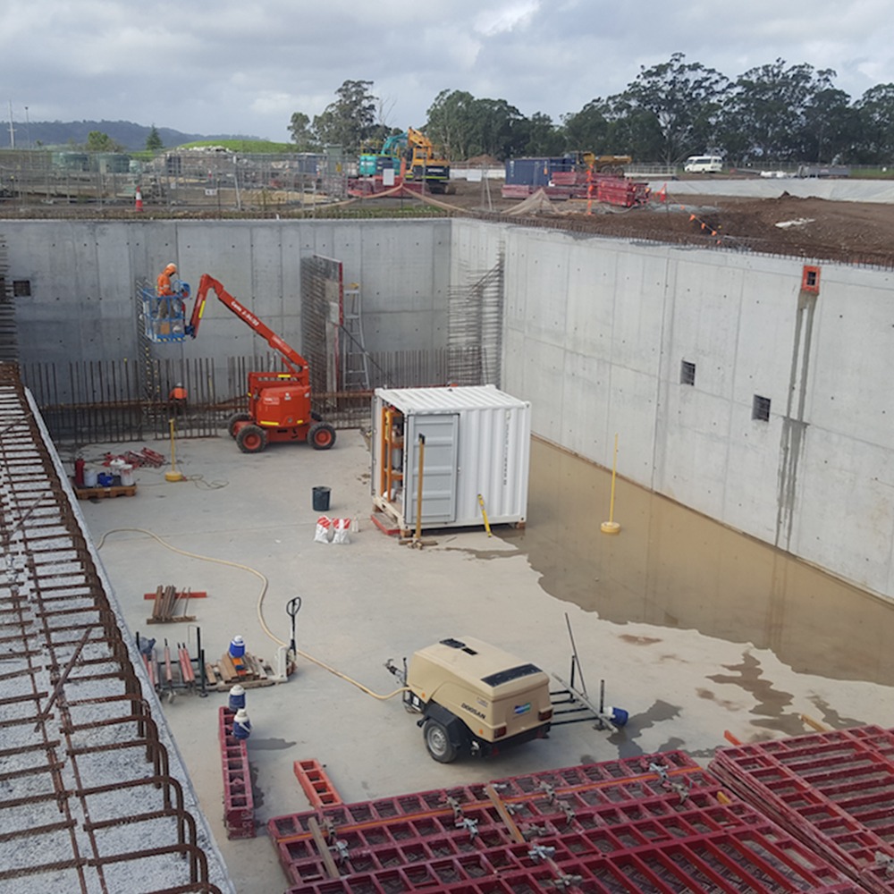 This picture is of a work site Monford Group was contracted to, showing the cranes, trucks and equipment Monford uses to complete big projects on time.