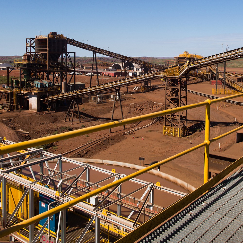 This is a photograph of a part of the process line at Solomon mine, specifically the large conveyor belts used to transfer the ore.